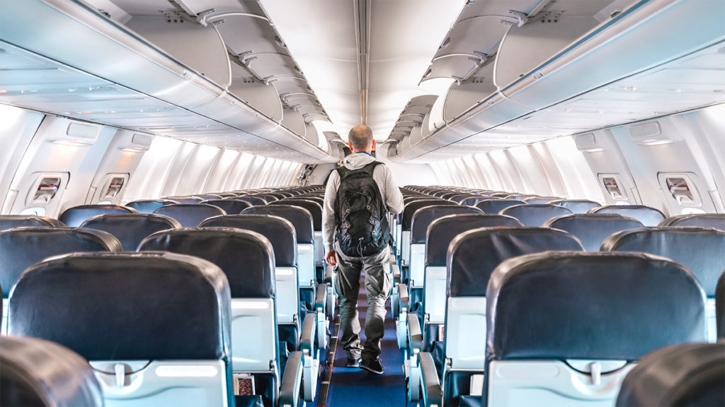 Passenger in empty airplane due to Covid-19 travel restrictions